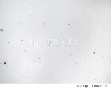 Mold on bathroom enamel. Mold spores in the bathroom. Black dots on a white background. A problem for everyday life. The need for a cleaning agent. Mold on bathroom enamel. Mold spores in the bathroom. Black dots on a white background. A problem for everyday life. The need for a cleaning agent. 140896930