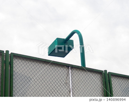 Brutal lamp over the sports ground. Modern lighting. Lantern in the park. Rectangular shape. 140896994