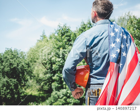 Construction worker and American flag Construction worker and American flag 140897217