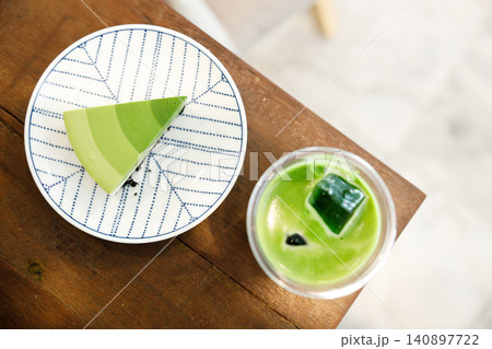 Green tea cake pie with gradient layered in cafe. Green tea cake pie with gradient layered in cafe. 140897722