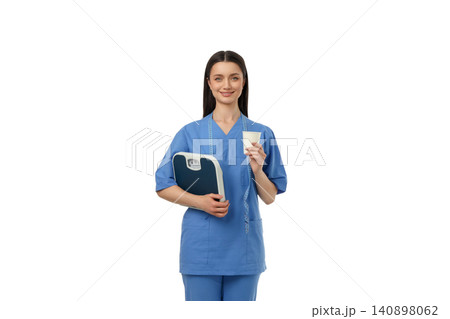 Health worker holds weight scale and card with data, isolated, PNG Health worker holds weight scale and card with data, isolated, PNG 140898062