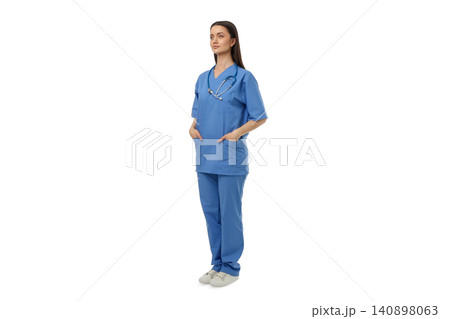 A confident person in scrubs with hands in pockets, isolated, PNG 140898063