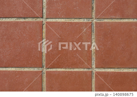 Red terracotta floor tiles forming a geometric pattern Red terracotta floor tiles forming a geometric pattern 140898675