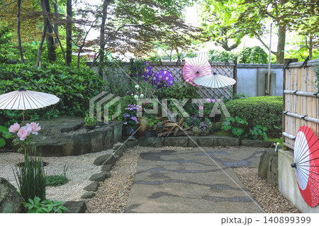 April 25 2026 Japanese Garden Path Decorated With Colorful Paper Umbrellas 140899399