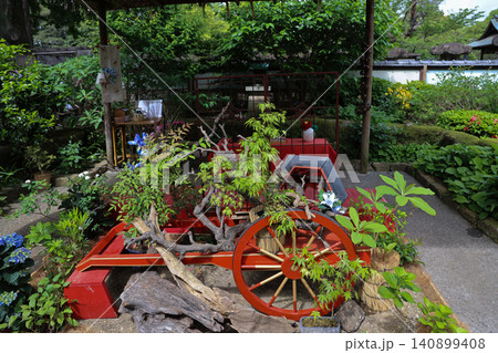 April 25 2026 Traditional Japanese Garden Display With Red Cart April 25 2026 Traditional Japanese Garden Display With Red Cart 140899408
