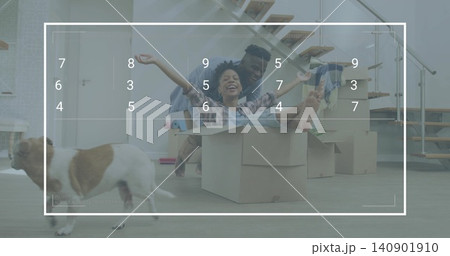 Playing plaid-shirt woman sitting inside box while man pushing at home, with dog, stacked boxes 140901910