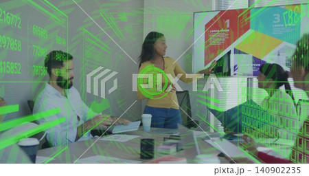 Presenting woman in yellow sweater and jeans pointing at monitor in conference room, with AR 140902235