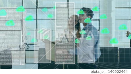 Analyzing team in collared shirts at office, viewing binary overlays and floating green cloud icons 140902464