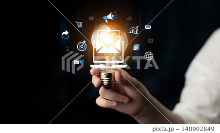 A Creative Light Bulb Concept Reflecting Ideas and Innovation with Digital Marketing Symbols in a Dark Background for Modern Business Solutions. Entropy A Creative Light Bulb Concept Reflecting Ideas and Innovation with Digital Marketing Symbols in a Dark Background for Modern Business Solutions. Entropy 140902849