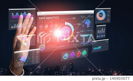 A hand interacts with a transparent data analytics interface displaying colorful graphs and charts, set against a city skyline at night, symbolizing innovation and technology. Sigmoid 140903077
