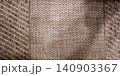 Macro texture background of beige woven burlap fabric with natural abstract fiber pattern 140903367