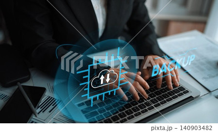 Business Professional Engaging with Technology and Cloud Backup Solutions at Office Desk with Laptop and Digital Interface Elements. Entropy Business Professional Engaging with Technology and Cloud Backup Solutions at Office Desk with Laptop and Digital Interface Elements. Entropy 140903482