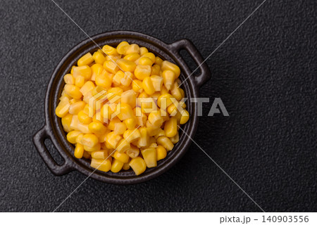 Golden, sweet canned corn kernels or maize for salads and vegetarian dishes. Canned corn Golden, sweet canned corn kernels or maize for salads and vegetarian dishes. Canned corn 140903556