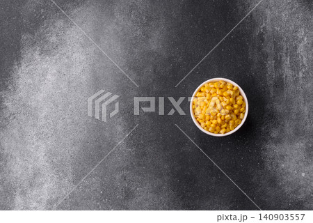 Golden, sweet canned corn kernels or maize for salads and vegetarian dishes. Canned corn Golden, sweet canned corn kernels or maize for salads and vegetarian dishes. Canned corn 140903557