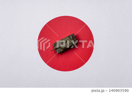 A tank on the Japanese flag as a conceptual backdrop representing defense A tank on the Japanese flag as a conceptual backdrop representing defense 140903590
