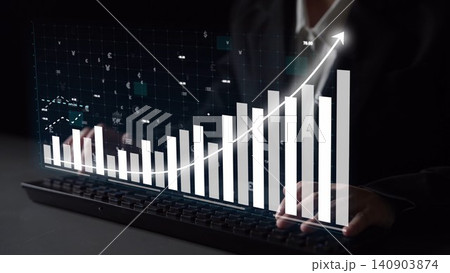 Business growth chart with a person typing on a keyboard, illustrating data analysis and financial success in a modern digital environment. Copula 140903874