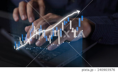 Person using laptop with keyboard surrounded by digital stock market graph and financial data, analyzing trends and making investment decisions in modern office Copula Person using laptop with keyboard surrounded by digital stock market graph and financial data, analyzing trends and making investment decisions in modern office Copula 140903976