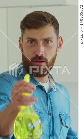 Vertical Video Portrait of man who is ready for housework. Vertical Video Portrait of man who is ready for housework. 140905372