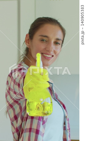 Vertical Video Portrait of housewife who is ready for housework. Vertical Video Portrait of housewife who is ready for housework. 140905383