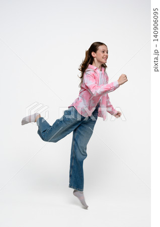 Happy teenage girl running and having fun Happy teenage girl running and having fun 140906095