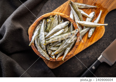 Bowl Of Fresh Small Fish On Wooden Bowl Rustic Seafood Ingredients For Cooking Bowl Of Fresh Small Fish On Wooden Bowl Rustic Seafood Ingredients For Cooking 140906604