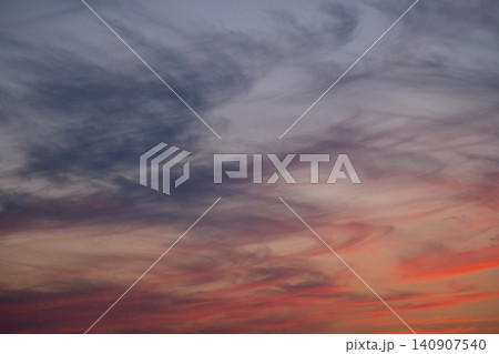 Dramatic sunset sky with swirling clouds. Colorful twilight atmosphere after rain. Dramatic sunset sky with swirling clouds. Colorful twilight atmosphere after rain. 140907540
