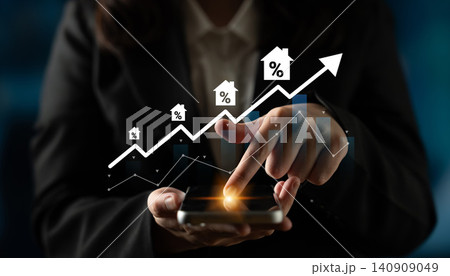 Business professional using smartphone with upward trend in housing market illustrated by graphs and icons symbolizing growth and investment opportunities Gantry 140909049