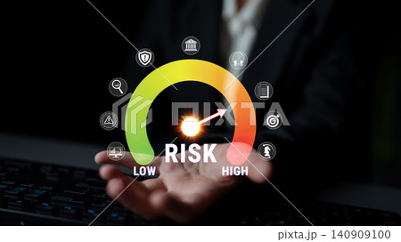 Man in Suit Holding Risk Meter Indicator with Visual Representations of Low and High Risk Management Concepts in Modern Business Environment Fluxor Man in Suit Holding Risk Meter Indicator with Visual Representations of Low and High Risk Management Concepts in Modern Business Environment Fluxor 140909100
