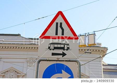Traffic Sign with Tram Symbol Indicating Lane Merge in Urban Setting Traffic Sign with Tram Symbol Indicating Lane Merge in Urban Setting 140909330