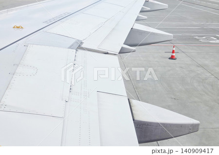 Aircraft Wing and Runway Scene: Aviation Travel and Airport Safety Elements Aircraft Wing and Runway Scene: Aviation Travel and Airport Safety Elements 140909417