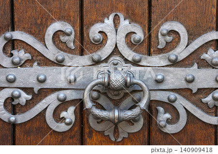 Ornate Iron Door Knocker on Wooden Door Vintage Architecture Detail for Home Decor and Design Inspiration Ornate Iron Door Knocker on Wooden Door Vintage Architecture Detail for Home Decor and Design Inspiration 140909418