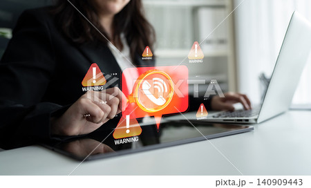 Business professional interacting with digital warning alerts while using laptop, showcasing technology risks in communication and data management environments Haptic 140909443