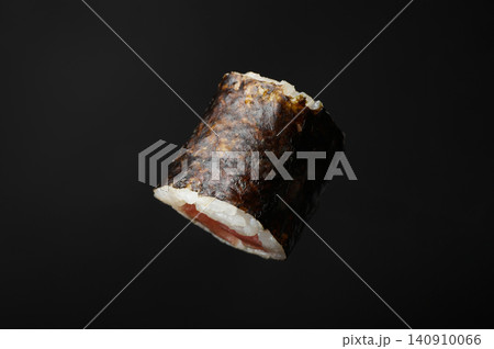 Sushi roll with tuna on black background 140910066