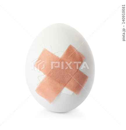 Cracked egg with sticking plasters isolated on white Cracked egg with sticking plasters isolated on white 140910081