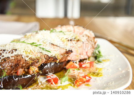 Delicious roasted meat served on plate, closeup Delicious roasted meat served on plate, closeup 140910286