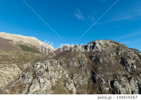 Rocky mountain cliffs and steep peaks in Abruzzo National Park Italy 140910567