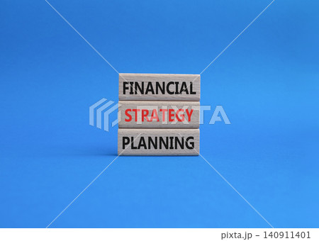 Financial strategy planning symbol. Concept word Financial strategy planning on wooden blocks. Beautiful blue background. Business and Financial strategy planning. Copy space 140911401