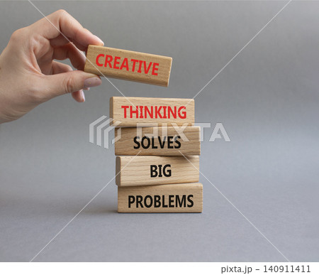 Creative Thinking symbol. Wooden blocks with words Creative Thinking Solves Big Problems. Businessman hand. Beautiful grey background. Businessman hand. Business and Creative Thinking concept. Copy Creative Thinking symbol. Wooden blocks with words Creative Thinking Solves Big Problems. Businessman hand. Beautiful grey background. Businessman hand. Business and Creative Thinking concept. Copy 140911411