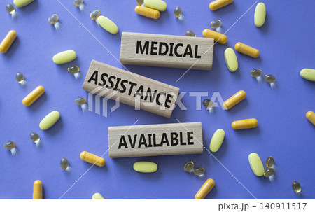 MEDICAL ASSISTANCE AVAILABLE symbol. Concept words MEDICAL ASSISTANCE AVAILABLE on wooden blocks. Beautiful purple background with pills. Healthcare and MEDICAL ASSISTANCE AVAILABLE concept. Copy MEDICAL ASSISTANCE AVAILABLE symbol. Concept words MEDICAL ASSISTANCE AVAILABLE on wooden blocks. Beautiful purple background with pills. Healthcare and MEDICAL ASSISTANCE AVAILABLE concept. Copy 140911517