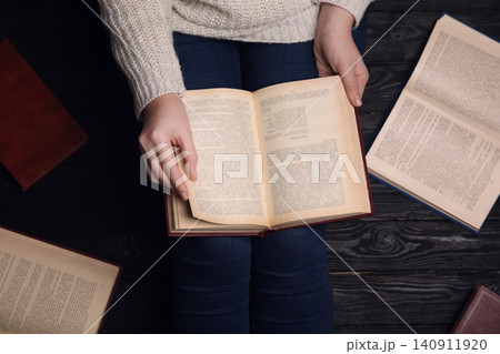 Woman reading book at home, top view Woman reading book at home, top view 140911920