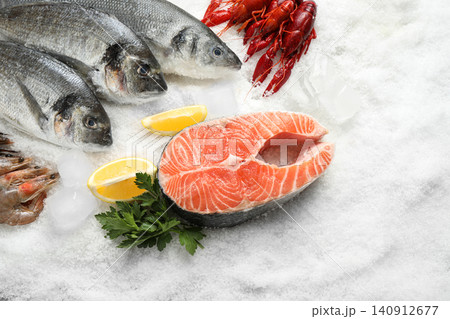 Fresh fish and different seafood on ice Fresh fish and different seafood on ice 140912677