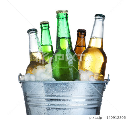 Beer in metal bucket with ice isolated on white Beer in metal bucket with ice isolated on white 140912806