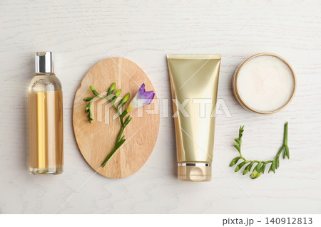 Flat lay composition with cosmetic products on white wooden table Flat lay composition with cosmetic products on white wooden table 140912813