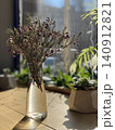 Wildflower Bouquet in Glass Vase Illuminated by Morning Sunlight 140912821