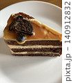 Chocolate Layer Cake with Caramel Topping and Cookie Decoration 140912832