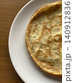 Fresh Homemade Thin Pancakes on White Plate in Natural Light 140912836