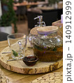 Glass Teapot with Herbal Tea Served with Honey 140912999