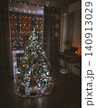 Decorated Christmas Tree Glowing with Warm Holiday Lights 140913029