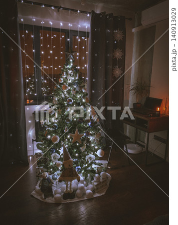 Decorated Christmas Tree Glowing with Warm Holiday Lights 140913029