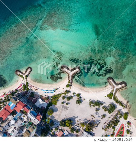 Aerial view of beachfront hotels and private beach at Maafushi island, Maldives 140913514